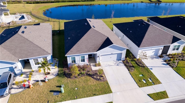 drone / aerial view featuring a water view