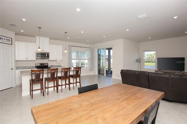 dining space with a healthy amount of sunlight