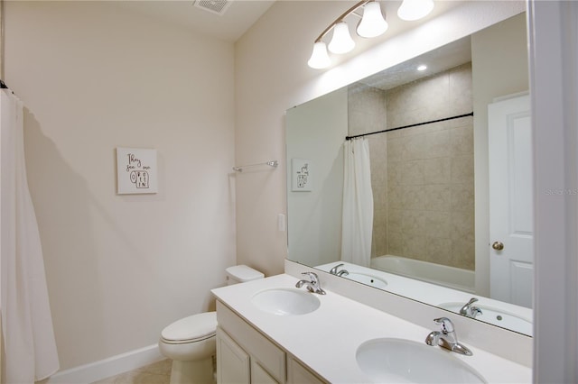 full bathroom featuring tile patterned floors, vanity, toilet, and shower / bath combo with shower curtain