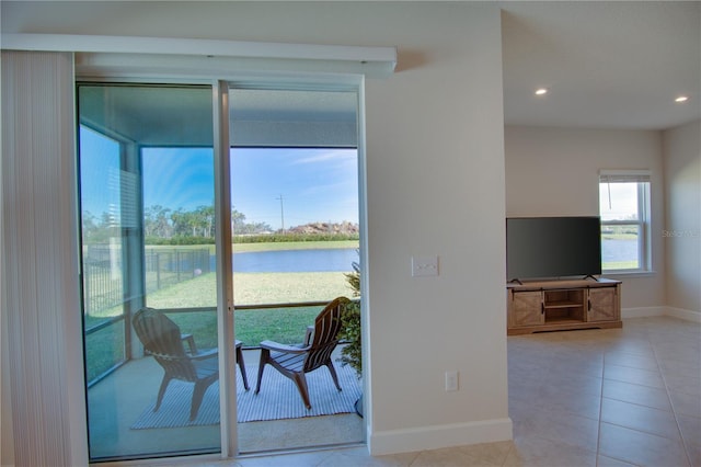 doorway to outside featuring light tile patterned flooring