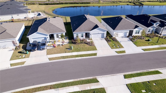 drone / aerial view with a water view