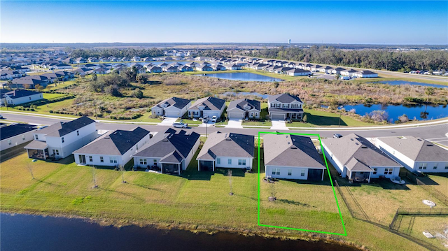 bird's eye view with a water view and a residential view