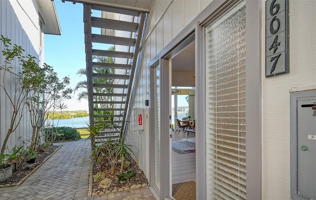 entrance to property featuring a water view