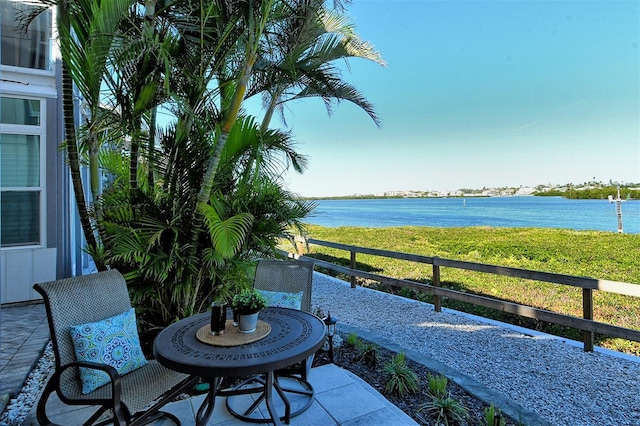 view of patio with a water view