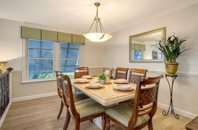 dining area with light hardwood / wood-style flooring