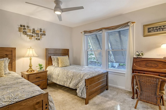 bedroom featuring ceiling fan and light colored carpet