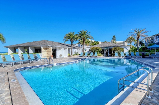 view of swimming pool with a patio