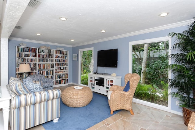 living room featuring crown molding and light carpet