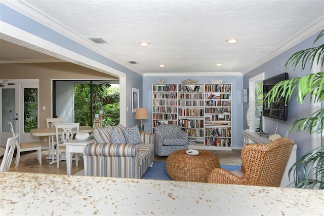 living area featuring crown molding