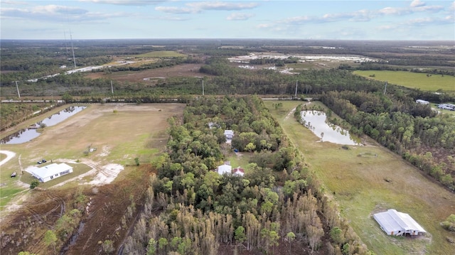 birds eye view of property featuring a rural view and a water view