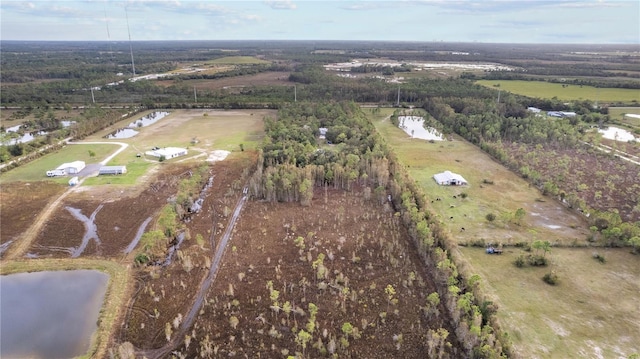 aerial view with a rural view and a water view