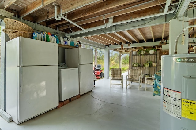 basement featuring white fridge, washer / dryer, and electric water heater