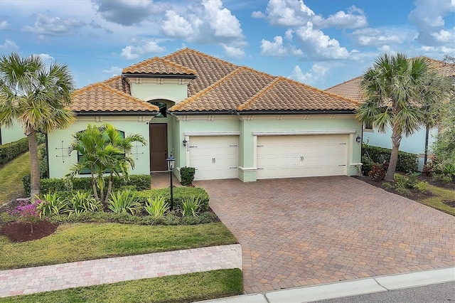 mediterranean / spanish-style home featuring a garage