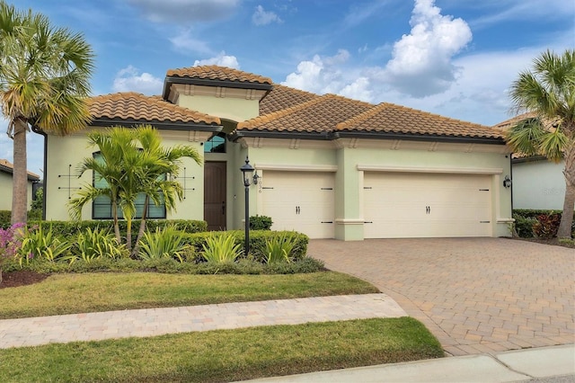 mediterranean / spanish house featuring a garage