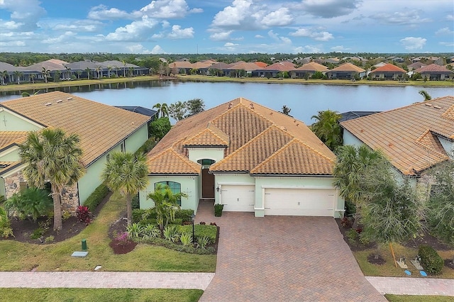 birds eye view of property featuring a water view