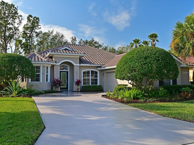 mediterranean / spanish-style home featuring a garage