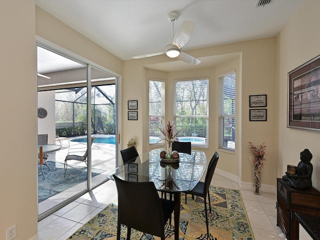 dining area featuring ceiling fan and light tile patterned floors