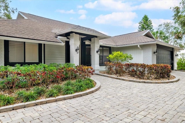 ranch-style house featuring a garage