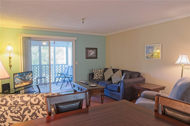 living room with crown molding, a textured ceiling, and hardwood / wood-style flooring