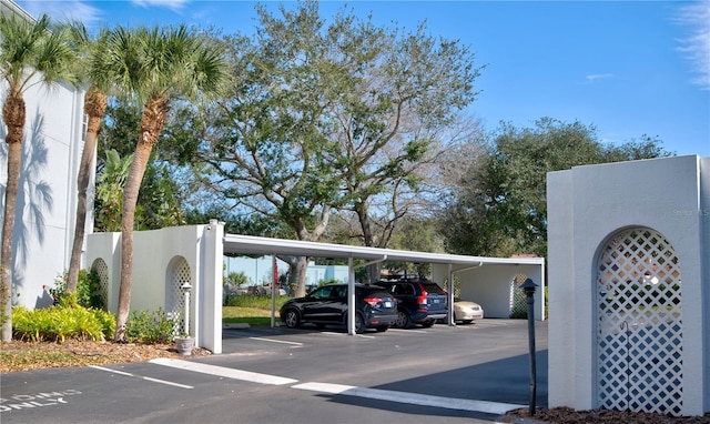 view of vehicle parking with a carport