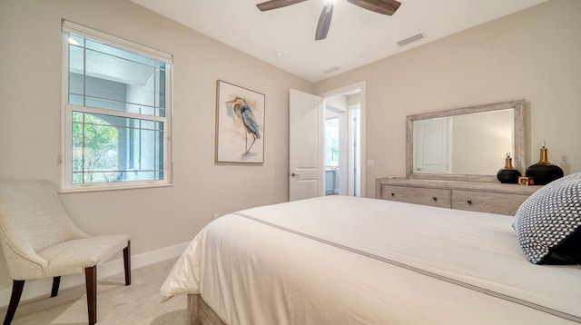 bedroom with ceiling fan and light colored carpet