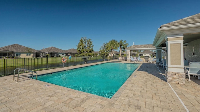 view of pool featuring a patio