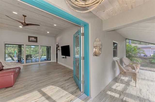 hallway with wooden ceiling, light wood-type flooring, and vaulted ceiling