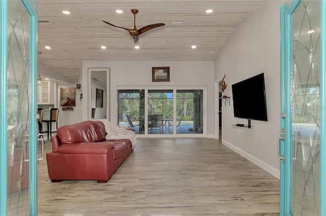 living room featuring light hardwood / wood-style floors and wood ceiling