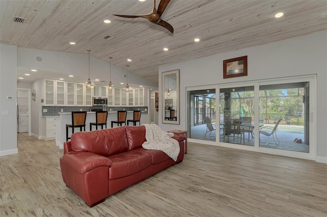 living room featuring lofted ceiling, wooden ceiling, light hardwood / wood-style floors, and ceiling fan