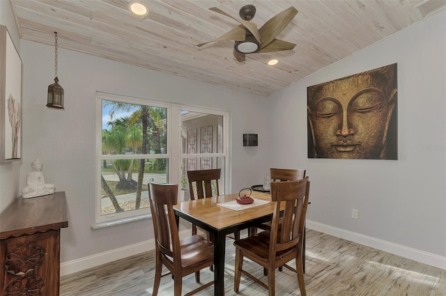 dining room featuring light hardwood / wood-style flooring, vaulted ceiling, ceiling fan, and wood ceiling