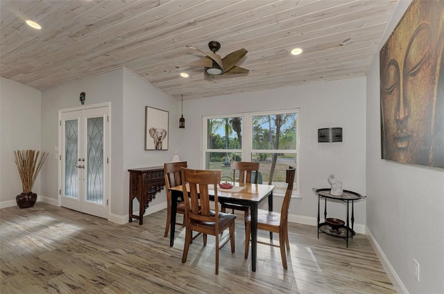 dining area with french doors, hardwood / wood-style flooring, lofted ceiling, and wood ceiling