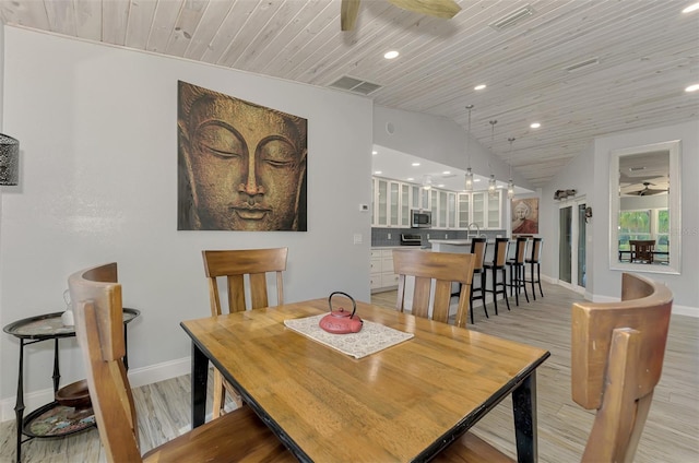 dining room with wooden ceiling, light wood-type flooring, vaulted ceiling, and ceiling fan