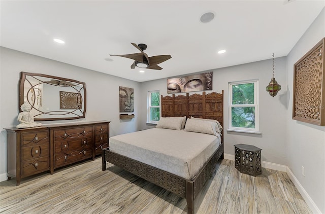 bedroom featuring light hardwood / wood-style flooring and ceiling fan