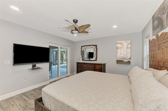 bedroom featuring hardwood / wood-style floors, ceiling fan, and access to outside