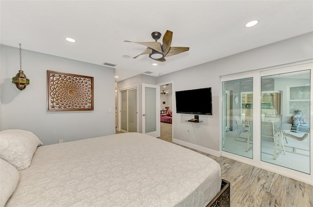 bedroom with a closet, access to exterior, ceiling fan, and light hardwood / wood-style flooring