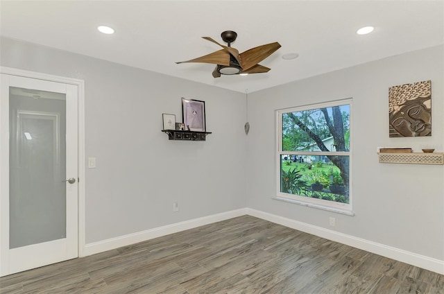 spare room featuring ceiling fan and wood-type flooring