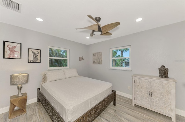 bedroom featuring light hardwood / wood-style floors and ceiling fan