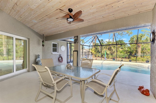 sunroom / solarium featuring ceiling fan, wooden ceiling, and vaulted ceiling