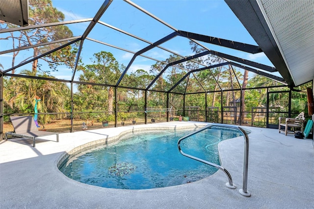 view of swimming pool with a lanai and a patio