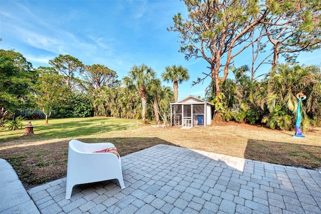 view of patio / terrace featuring a sunroom