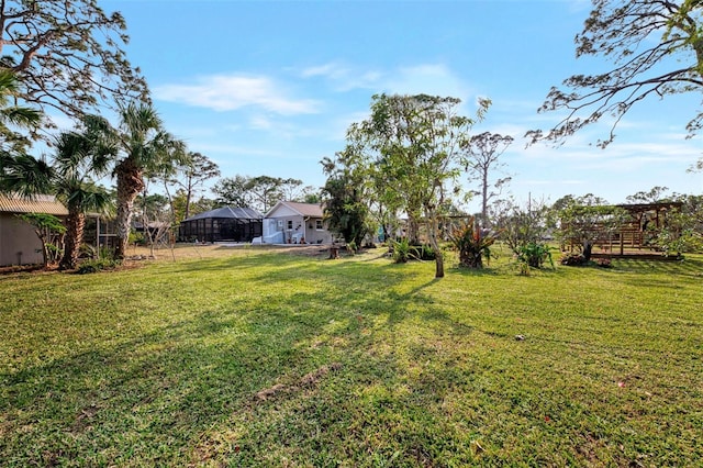 view of yard with a lanai