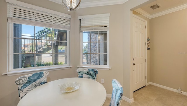 tiled dining area with ornamental molding, visible vents, and baseboards