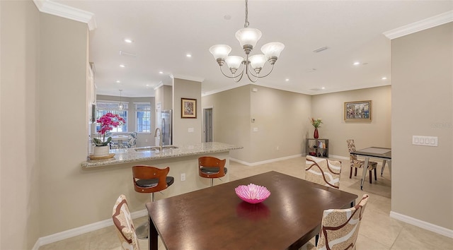 dining room featuring a notable chandelier, light tile patterned floors, recessed lighting, ornamental molding, and baseboards