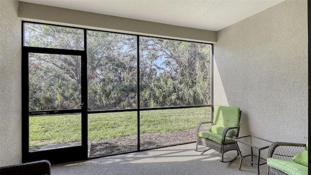 unfurnished sunroom featuring plenty of natural light