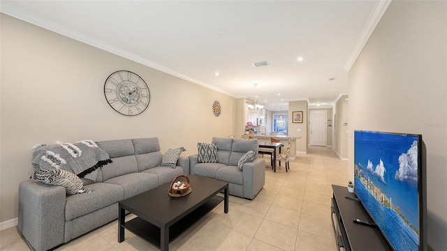 living area with ornamental molding, visible vents, baseboards, and light tile patterned floors