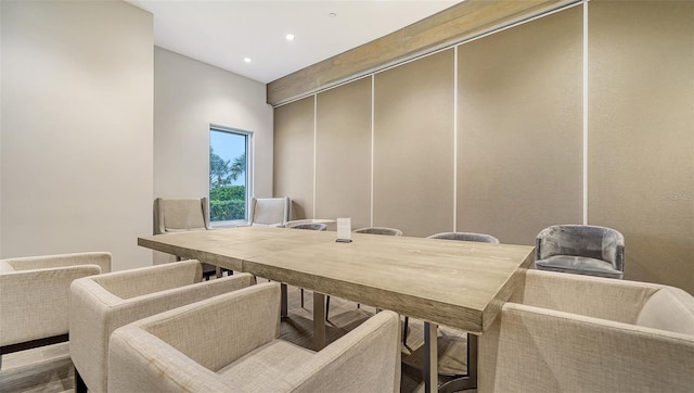 dining space featuring wood finished floors and recessed lighting