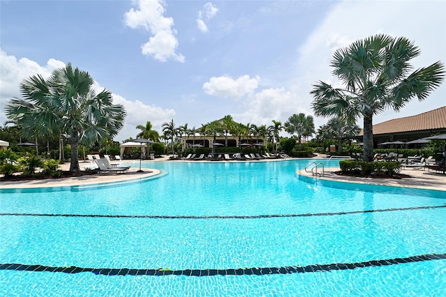 community pool featuring a patio and a gazebo