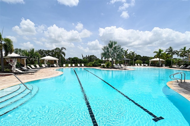 pool featuring a gazebo and a patio area