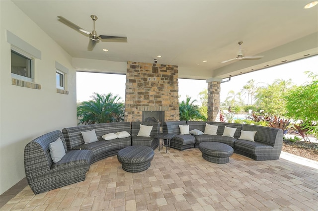 view of patio with ceiling fan and an outdoor living space