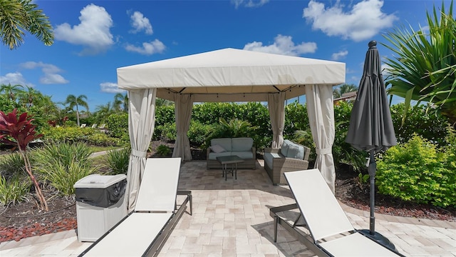 view of patio featuring outdoor lounge area and a gazebo